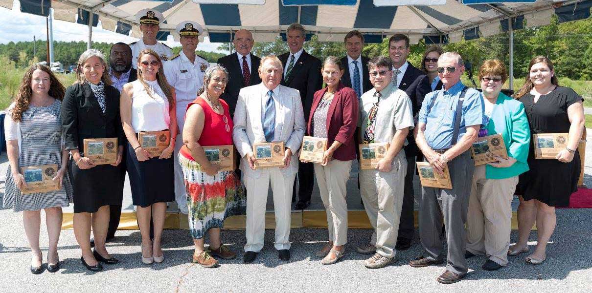 Group of people with at the ceremony with their plaques.