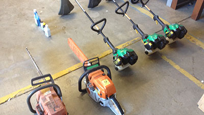 Image shows 5 machines, including weed trimmers and chain saws.